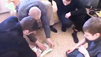 Olga plays cards with the guys